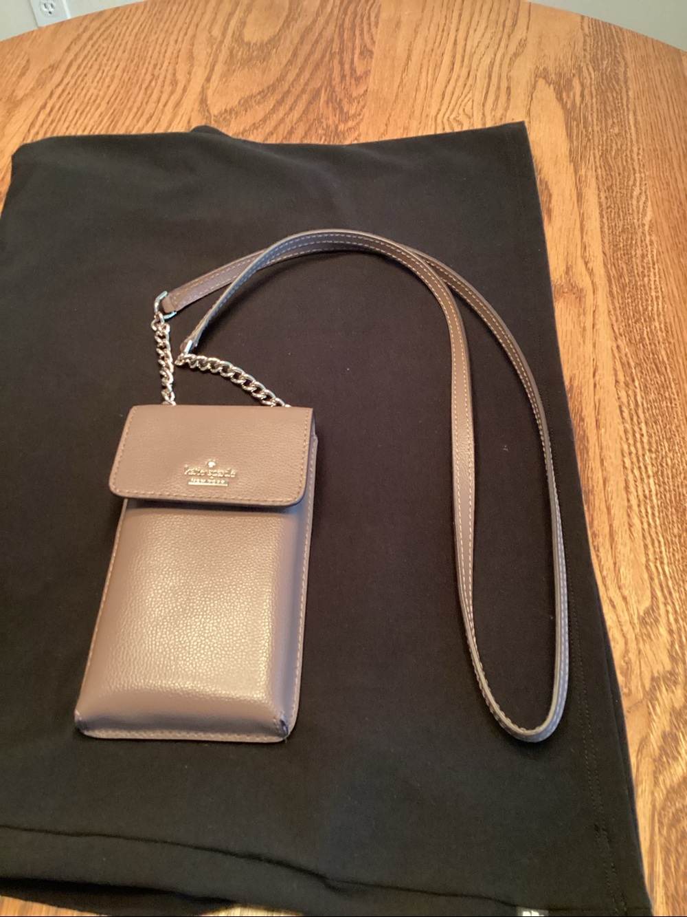 KateSpade tan leather crossbody phone pouch with chain strap